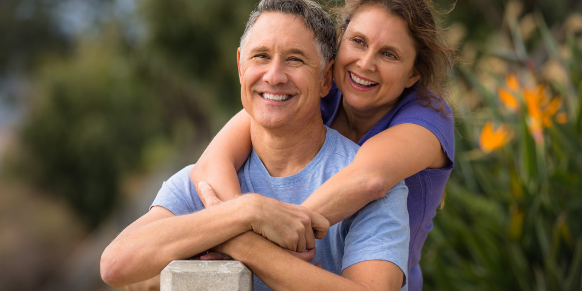 Portrait of an elder couple in a park