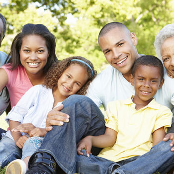 Multi Generational Family smiling and sitting outside